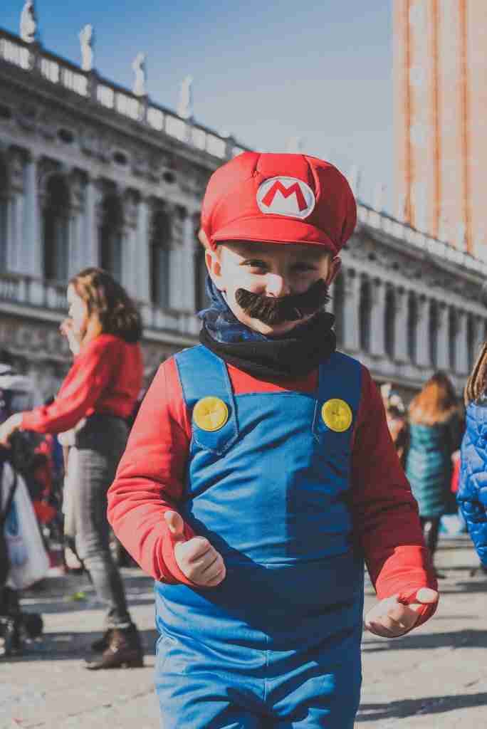 small child dressed as Mario