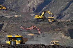 Excavators mining a mountainside
